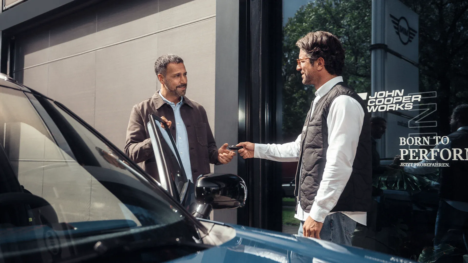MINI Service consultant advising customer about service plans at MINI Centre.